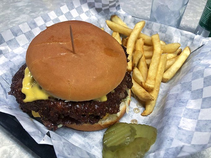 Smash burger with melted cheese and fries
