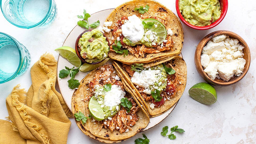 Chicken street tacos with onion, cilantro and lime